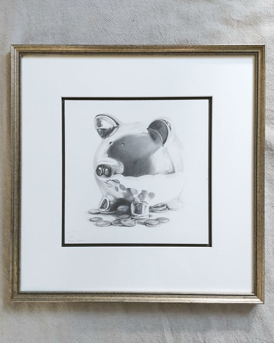 Framed realistic drawing of a piggybank with coins